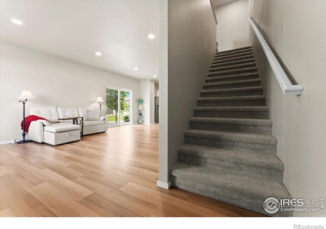 3635 Ronald Reagan Ave, Wellington, CO 80549 - stairway featuring wood finished floors, recessed lighting, and baseboards