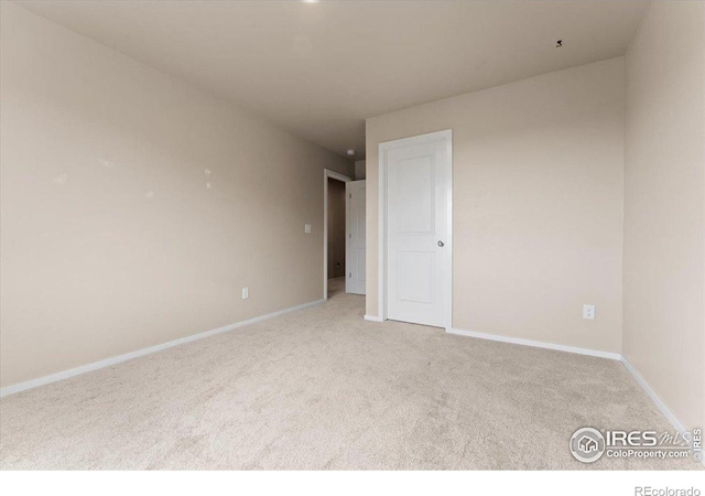 3635 Ronald Reagan Ave, Wellington, CO 80549 - spare room featuring carpet flooring and baseboards