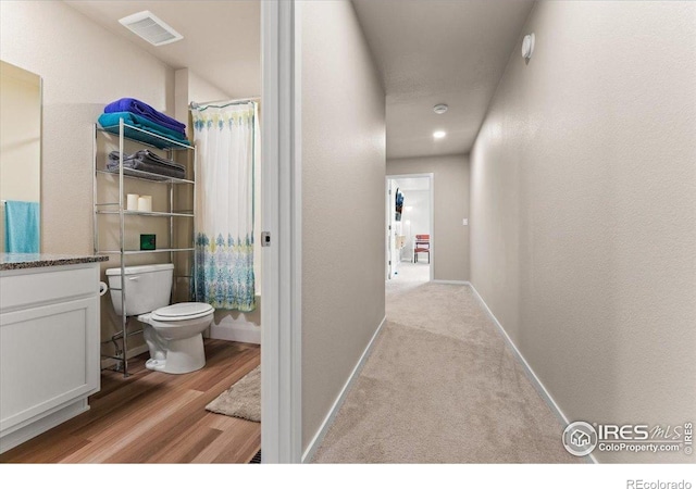 3635 Ronald Reagan Ave, Wellington, CO 80549 - corridor featuring baseboards and wood finished floors