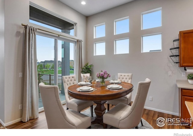 3997 Forest Lake Ct, Loveland, CO 80538 - dining space with wood finished floors, baseboards, and recessed lighting