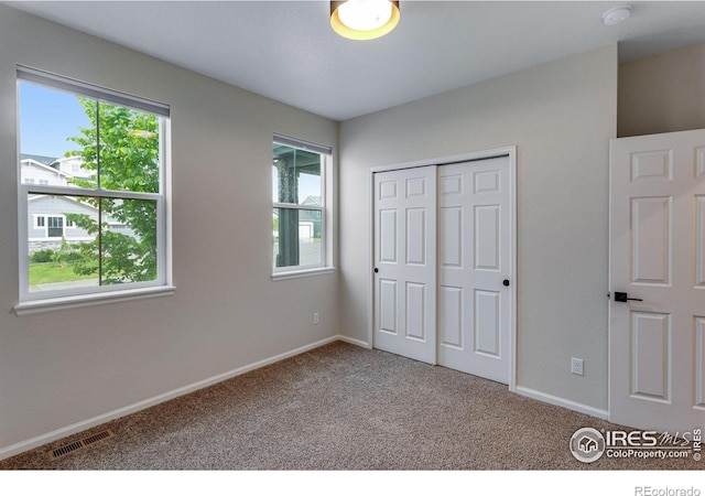 3997 Forest Lake Ct, Loveland, CO 80538 - unfurnished bedroom featuring carpet, a closet, and baseboards