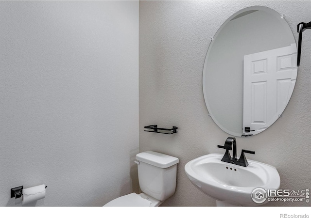 3997 Forest Lake Ct, Loveland, CO 80538 - half bath featuring a sink and toilet