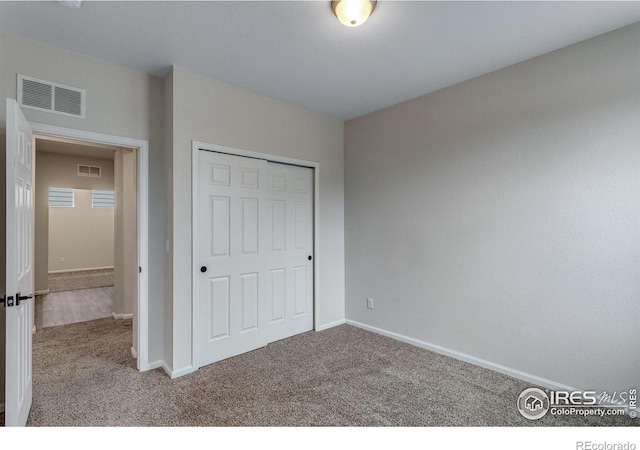 3997 Forest Lake Ct, Loveland, CO 80538 - unfurnished bedroom featuring carpet floors, baseboards, and a closet