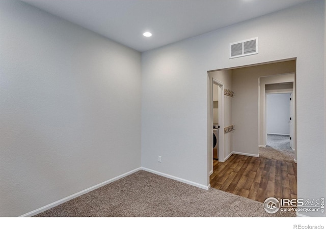 3997 Forest Lake Ct, Loveland, CO 80538 - spare room with baseboards, carpet floors, recessed lighting, and washer / clothes dryer