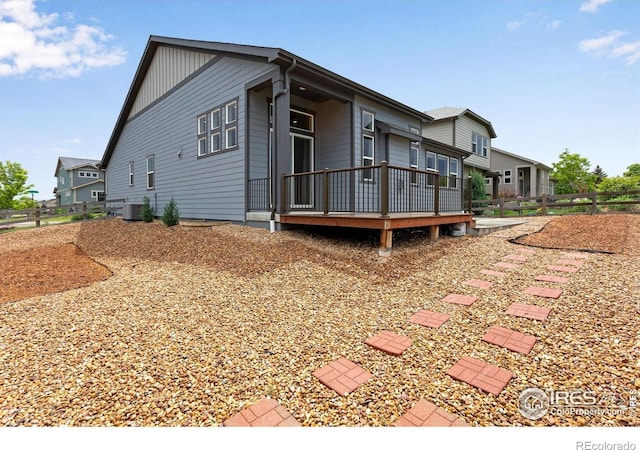 3997 Forest Lake Ct, Loveland, CO 80538 - view of side of property with a wooden deck and central AC unit