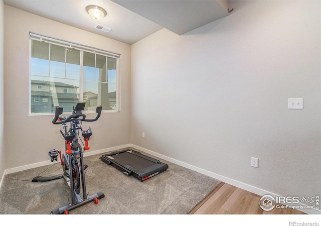 3960 Sweetgum St, Wellington, CO 80549 - exercise room with baseboards and wood finished floors