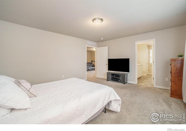 3960 Sweetgum St, Wellington, CO 80549 - bedroom with light carpet, baseboards, and ensuite bath