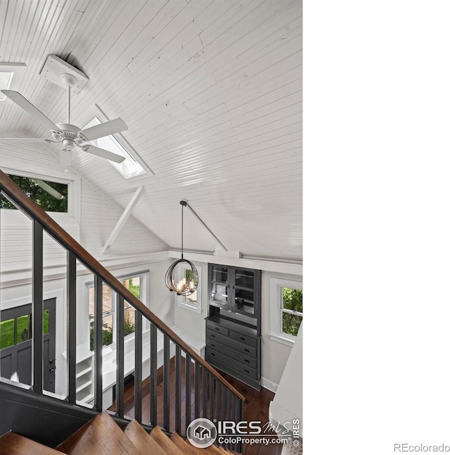 1010 Euclid Ave, Boulder, CO 80302 - staircase featuring a skylight, wood finished floors, a ceiling fan, lofted ceiling, and a chandelier