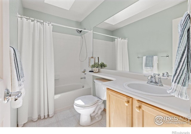 10400 Foxfire St, Firestone, CO 80504 - full bathroom with toilet, shower / bathtub combination with curtain, vanity, and a skylight