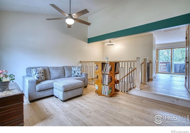 10940 Utica Ct, Westminster, CO 80031 - living room featuring wood finished floors, a ceiling fan, and high vaulted ceiling