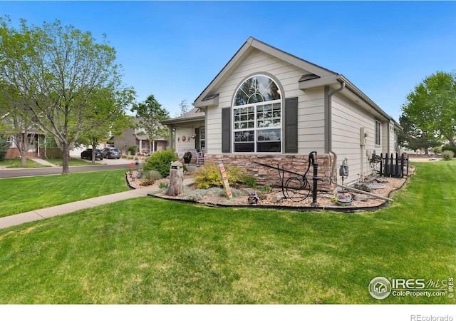 1421 Snipe Ln, Fort Collins, CO 80524 - view of front of house with a front yard and stone siding