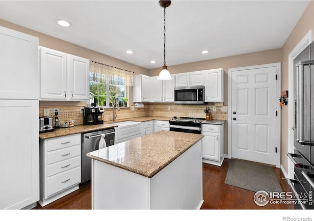 1421 Snipe Ln, Fort Collins, CO 80524 - kitchen with stainless steel appliances, a sink, backsplash, dark wood-style floors, and recessed lighting