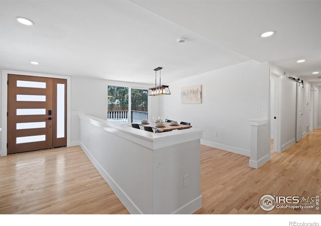 6766 Zenobia Loop, Westminster, CO 80030 - foyer with light wood-type flooring, recessed lighting, baseboards, and a chandelier