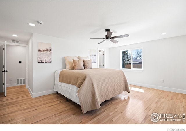 6766 Zenobia Loop, Westminster, CO 80030 - bedroom with light wood finished floors, baseboards, recessed lighting, and ceiling fan