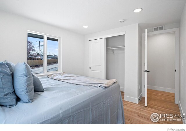 6766 Zenobia Loop, Westminster, CO 80030 - bedroom featuring light wood finished floors, a closet, recessed lighting, and baseboards