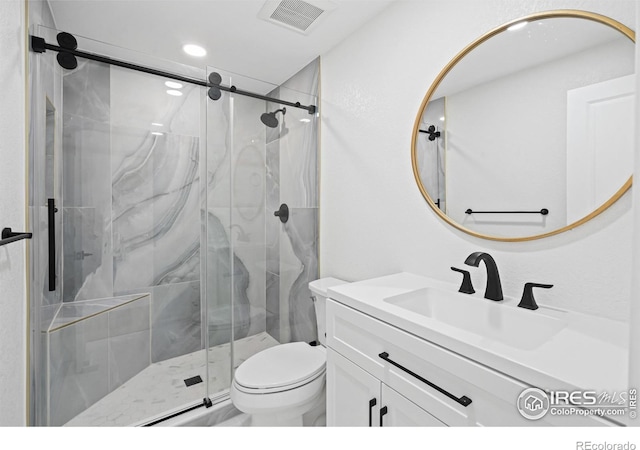 6766 Zenobia Loop, Westminster, CO 80030 - full bath featuring vanity, a marble finish shower, toilet, and recessed lighting