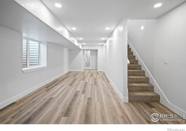 6766 Zenobia Loop, Westminster, CO 80030 - basement with stairway, light wood finished floors, recessed lighting, and baseboards