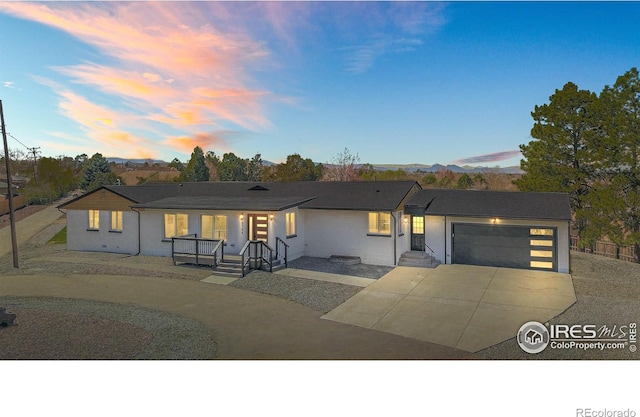 6766 Zenobia Loop, Westminster, CO 80030 - view of front of property featuring curved driveway and an attached garage