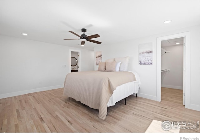 6766 Zenobia Loop, Westminster, CO 80030 - bedroom with light wood-style flooring, baseboards, a spacious closet, recessed lighting, and ceiling fan