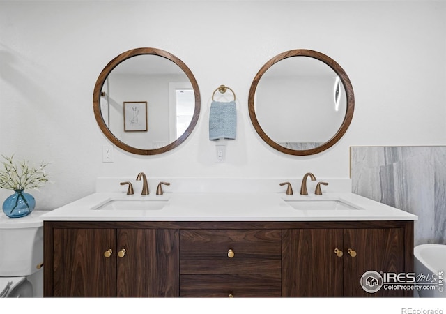 6766 Zenobia Loop, Westminster, CO 80030 - bathroom with double vanity and toilet