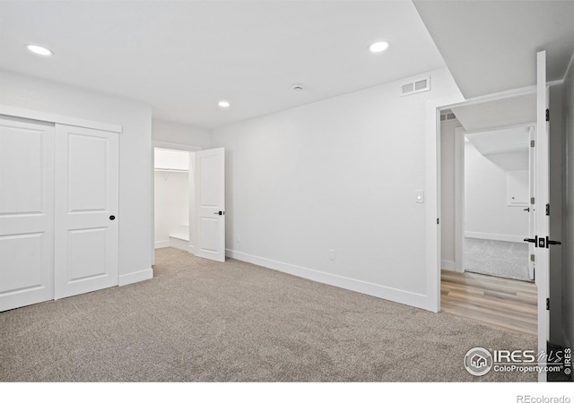 6766 Zenobia Loop, Westminster, CO 80030 - unfurnished bedroom featuring carpet flooring, recessed lighting, a closet, and baseboards