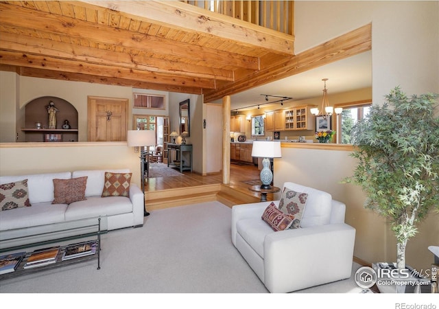 187 Rocky Knob Ln, Nederland, CO 80466 - living area featuring a chandelier and wood ceiling with exposed beams