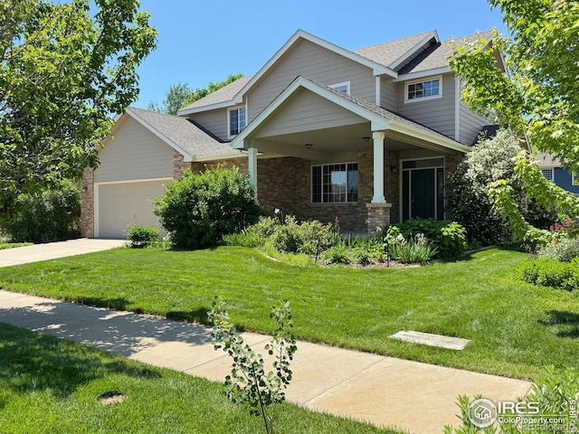 3385 Laplata Ave, Loveland, CO 80538 - view of front facade featuring brick siding, a garage, a front yard, driveway, and a shingled roof
