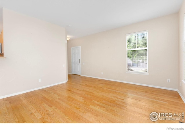 3180 Springfield Dr, Loveland, CO 80538 - unfurnished room with light wood-style flooring and baseboards