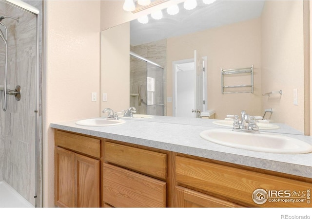 3180 Springfield Dr, Loveland, CO 80538 - full bath featuring a stall shower and double vanity