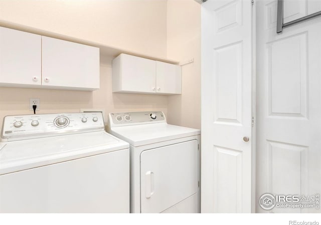 3180 Springfield Dr, Loveland, CO 80538 - laundry area featuring cabinet space and washing machine and clothes dryer