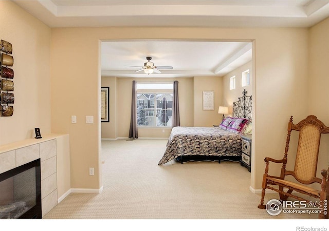 1060 Arrowhead Ct, Erie, CO 80516 - carpeted bedroom featuring a fireplace, baseboards, and a ceiling fan