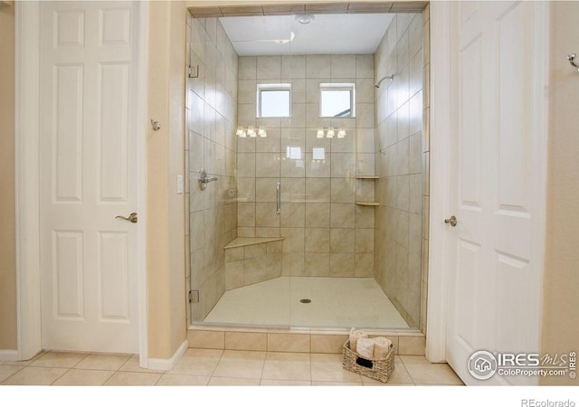 1060 Arrowhead Ct, Erie, CO 80516 - bathroom featuring tile patterned floors, a shower stall, and baseboards