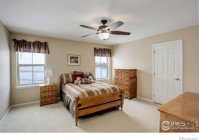1060 Arrowhead Ct, Erie, CO 80516 - bedroom featuring light carpet, baseboards, and ceiling fan