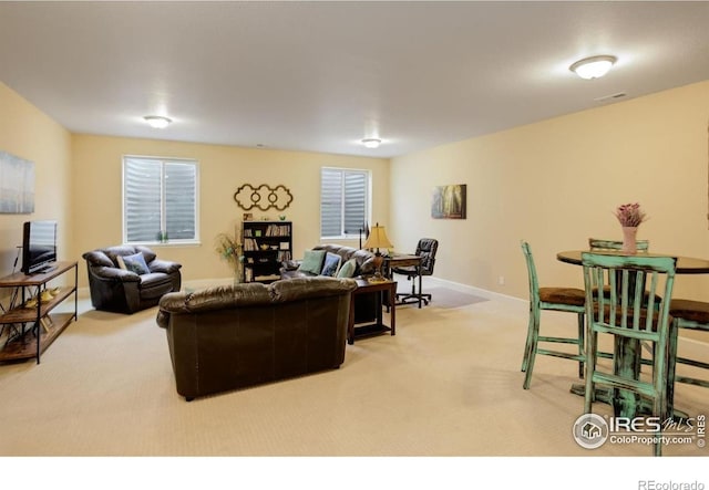1060 Arrowhead Ct, Erie, CO 80516 - carpeted living area with baseboards