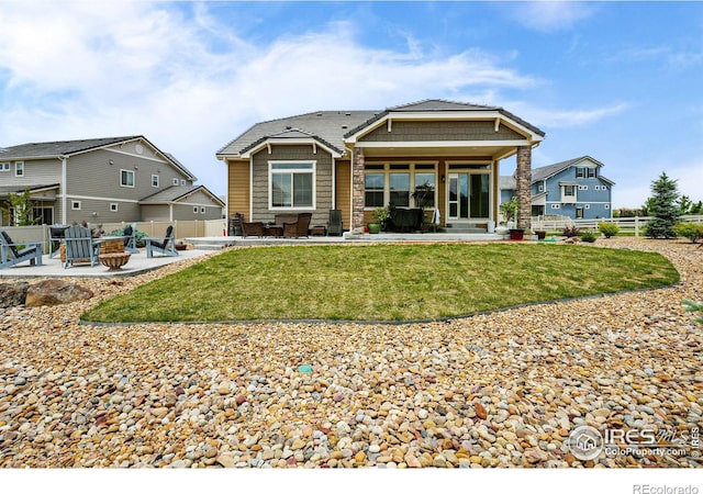 1060 Arrowhead Ct, Erie, CO 80516 - rear view of house with a patio area and a fire pit