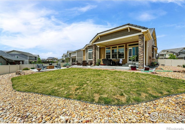 1060 Arrowhead Ct, Erie, CO 80516 - back of property featuring a patio area, a residential view, and stone siding