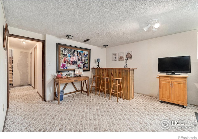 6009 W 28th St W, Greeley, CO 80634 - indoor dry bar with light colored carpet and a textured ceiling