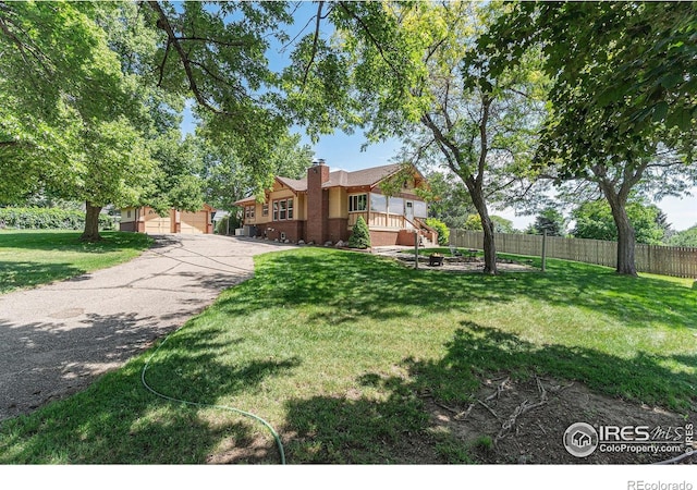 6009 W 28th St W, Greeley, CO 80634 - view of front of house with a chimney and a wooden deck