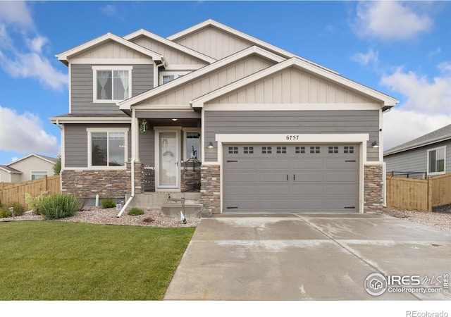6757 Sage Meadows Dr, Wellington, CO 80549 - craftsman-style home featuring stone siding, concrete driveway, board and batten siding, and an attached garage
