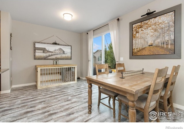 6757 Sage Meadows Dr, Wellington, CO 80549 - dining area featuring wood finished floors and baseboards