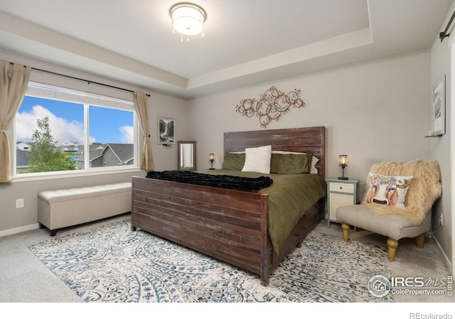 6757 Sage Meadows Dr, Wellington, CO 80549 - carpeted bedroom featuring baseboards and a tray ceiling