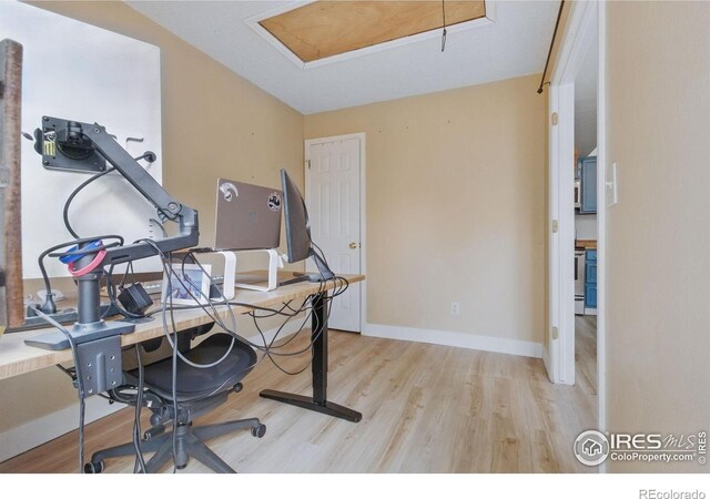 6076 Gunbarrel Ave Unit F, Boulder, CO 80301 - home office with attic access, light wood-style floors, and baseboards
