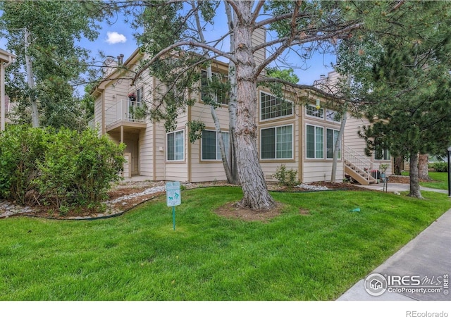 6076 Gunbarrel Ave Unit F, Boulder, CO 80301 - view of front of home with a balcony and a front yard