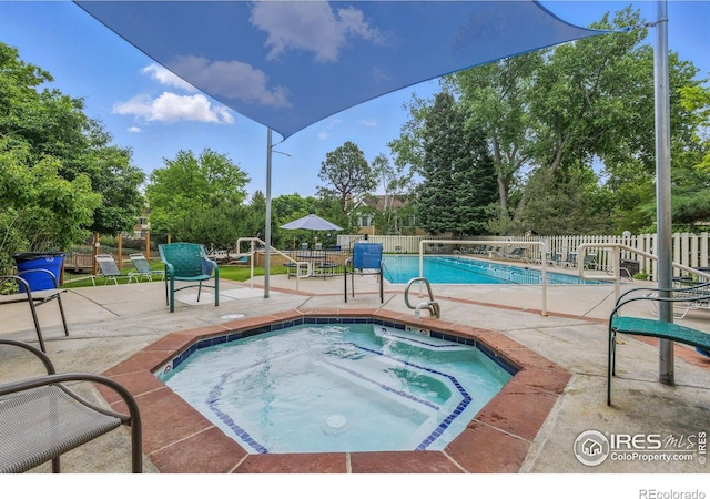 6076 Gunbarrel Ave Unit F, Boulder, CO 80301 - community pool with a community hot tub, a patio, a fenced backyard, and view of scattered trees