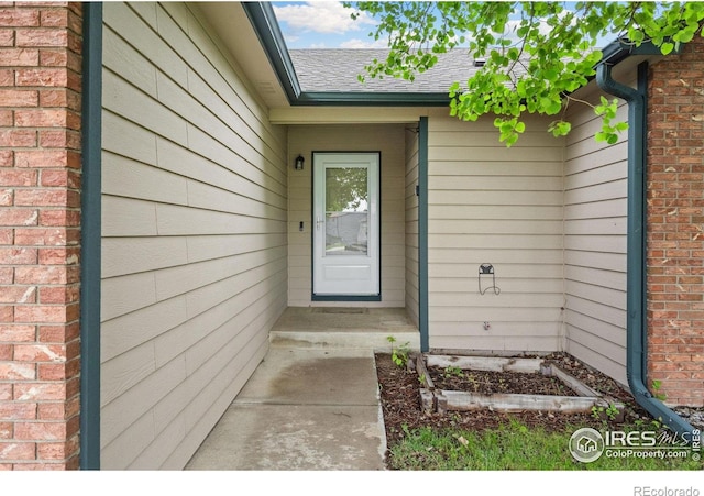3816 Partridge Ct, Evans, CO 80620 - doorway to property featuring a shingled roof