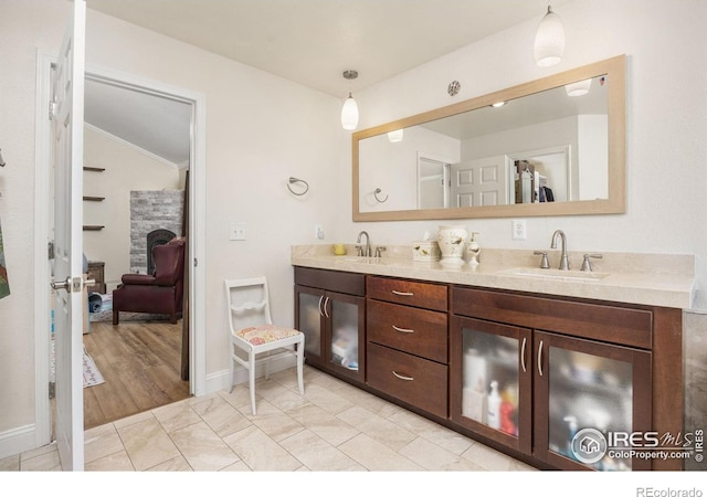 1892 Bell Dr, Erie, CO 80516 - full bathroom featuring vaulted ceiling, double vanity, and baseboards