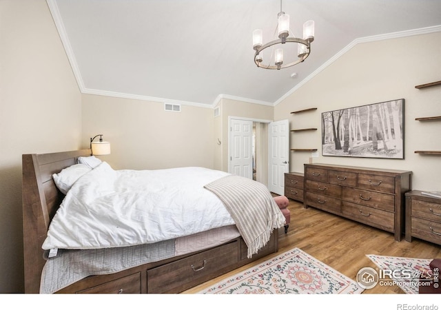 1892 Bell Dr, Erie, CO 80516 - bedroom with vaulted ceiling, a chandelier, wood finished floors, and ornamental molding