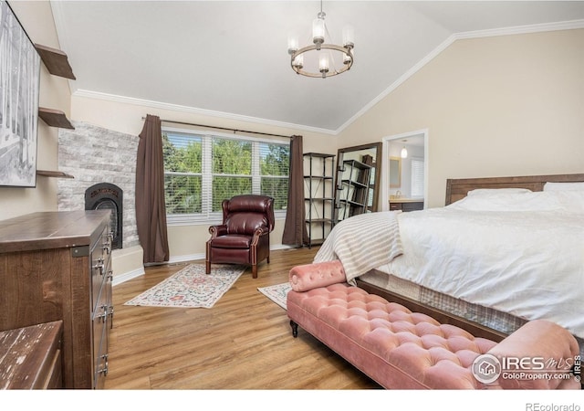 1892 Bell Dr, Erie, CO 80516 - bedroom featuring a chandelier, light wood-type flooring, vaulted ceiling, baseboards, and ornamental molding