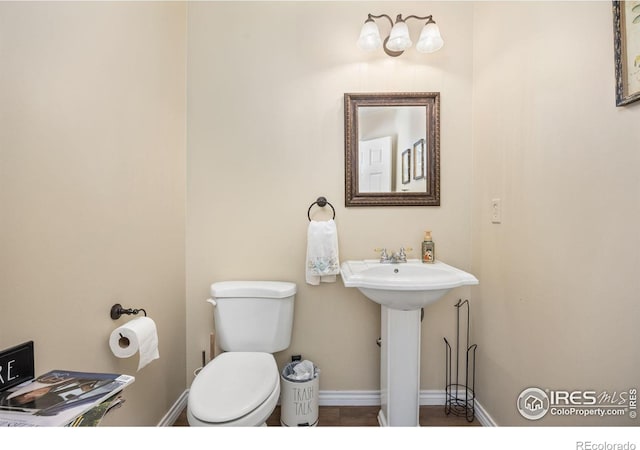 1892 Bell Dr, Erie, CO 80516 - half bath with toilet and baseboards