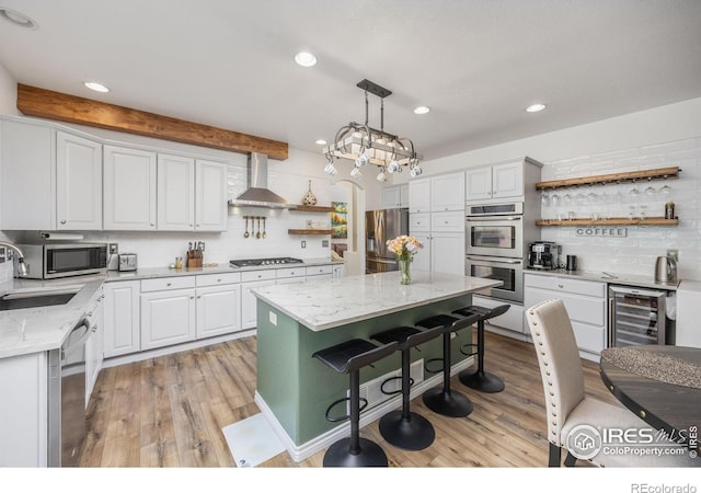 1892 Bell Dr, Erie, CO 80516 - kitchen featuring open shelves, beverage cooler, stainless steel appliances, a sink, and wall chimney range hood